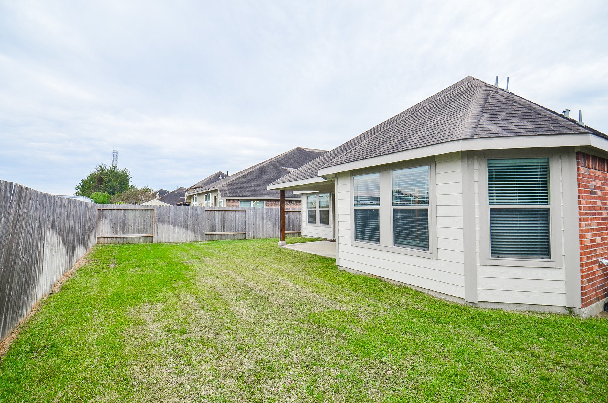 17902 Logans Pine Drive Tomball, TX 77377 - Photo 32 of 32 a house that is sitting in the grass