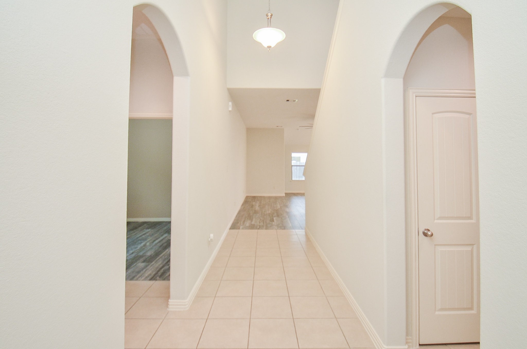 17902 Logans Pine Drive Tomball, TX 77377 - Photo 5 of 32 a view of a hallway with wooden floor and entryway