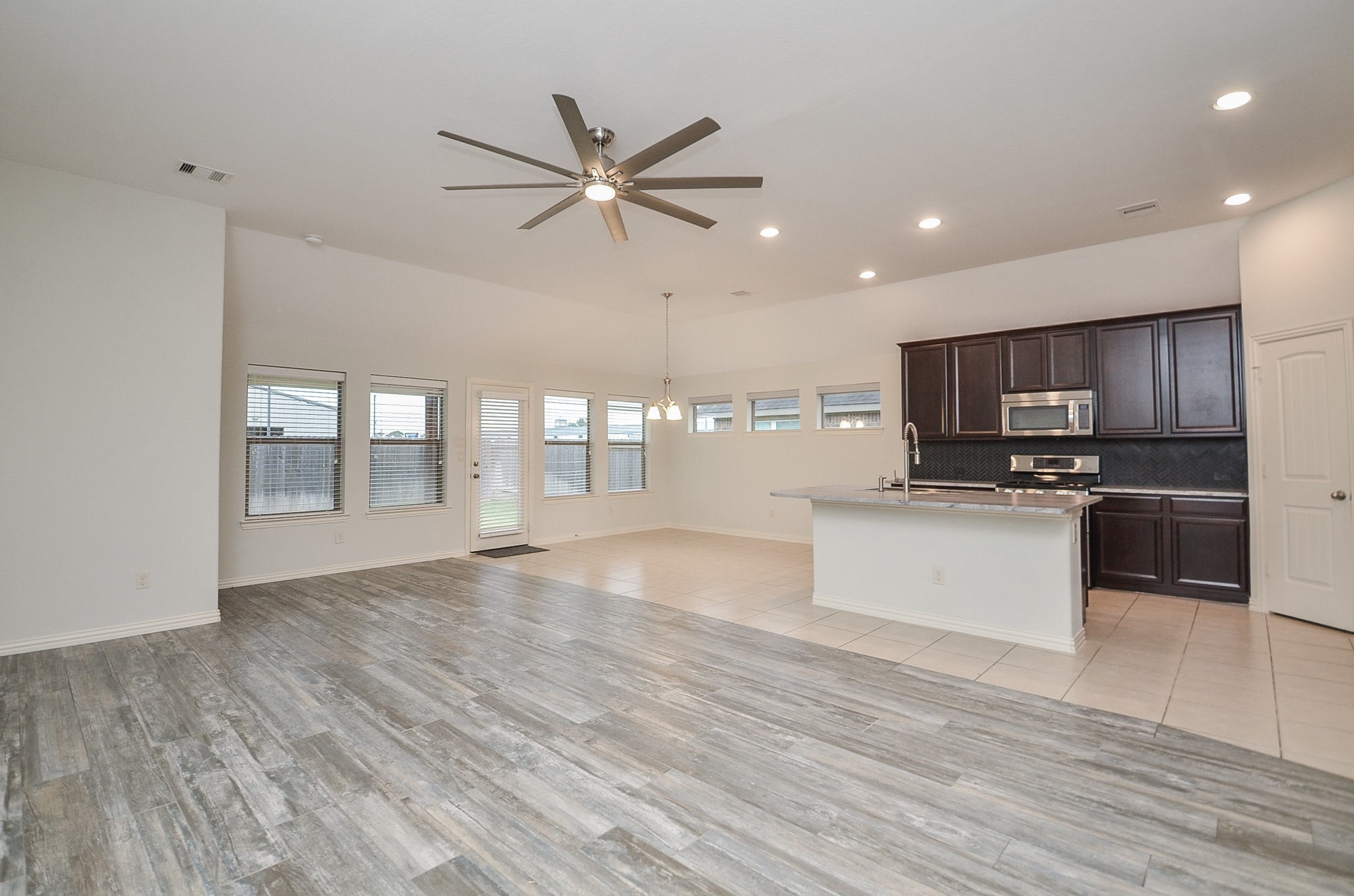 17902 Logans Pine Drive Tomball, TX 77377 - Photo 8 of 32 a view of kitchen with cabinets and wooden floor