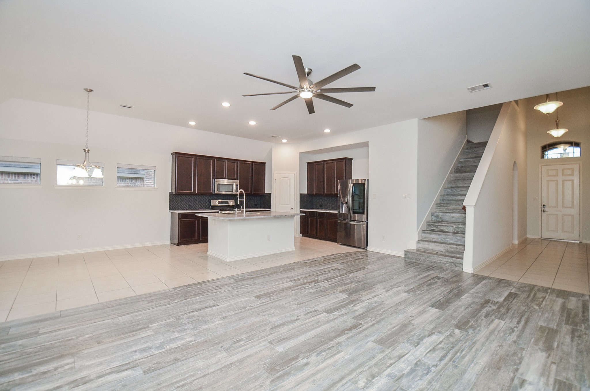 17902 Logans Pine Drive Tomball, TX 77377 - Photo 9 of 32 a view of kitchen with microwave and refrigerator
