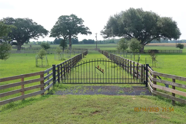 a view of park with bench next to a lake
