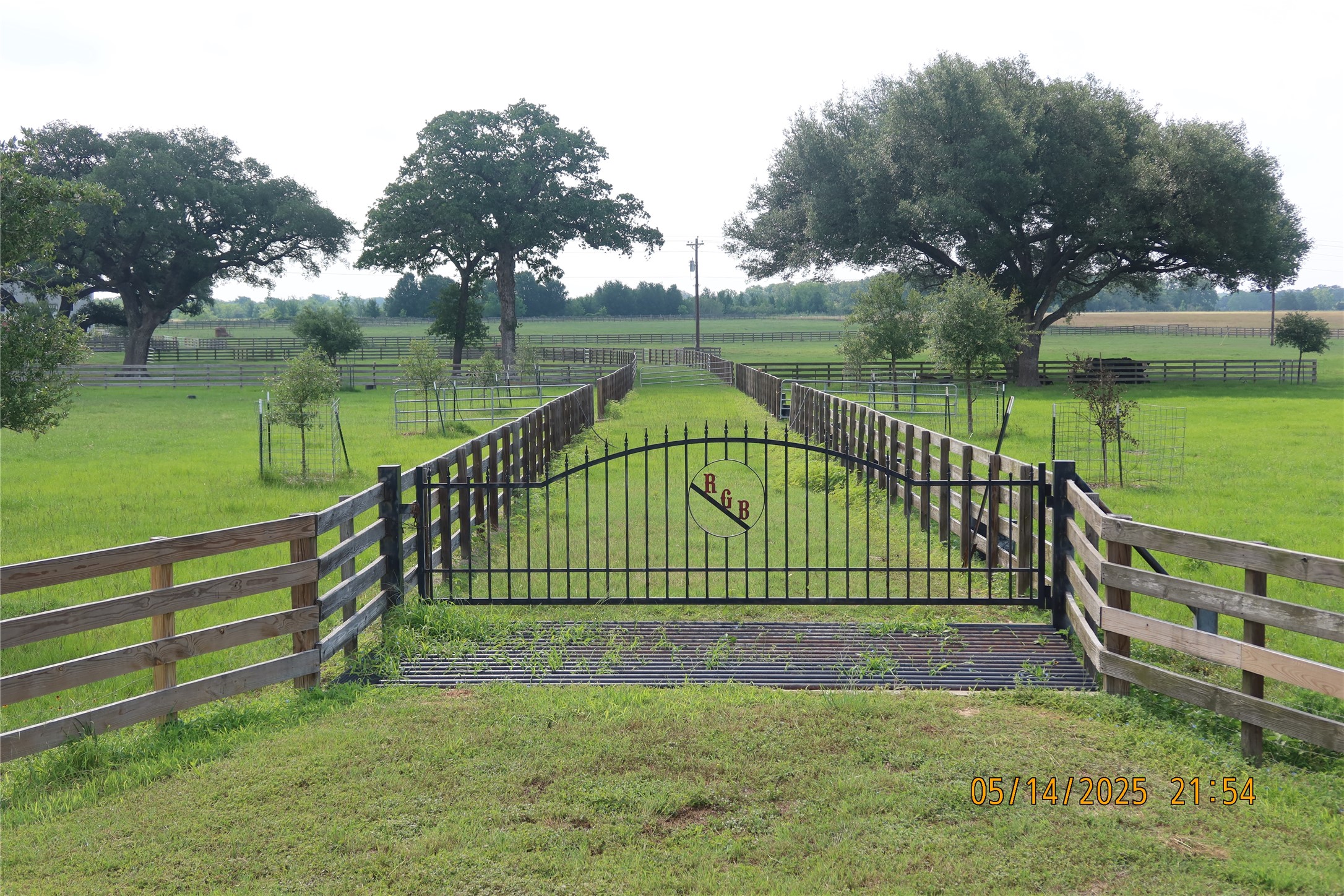 a view of park with bench next to a lake