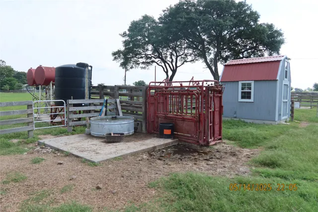 a view of a chair and table in the yard