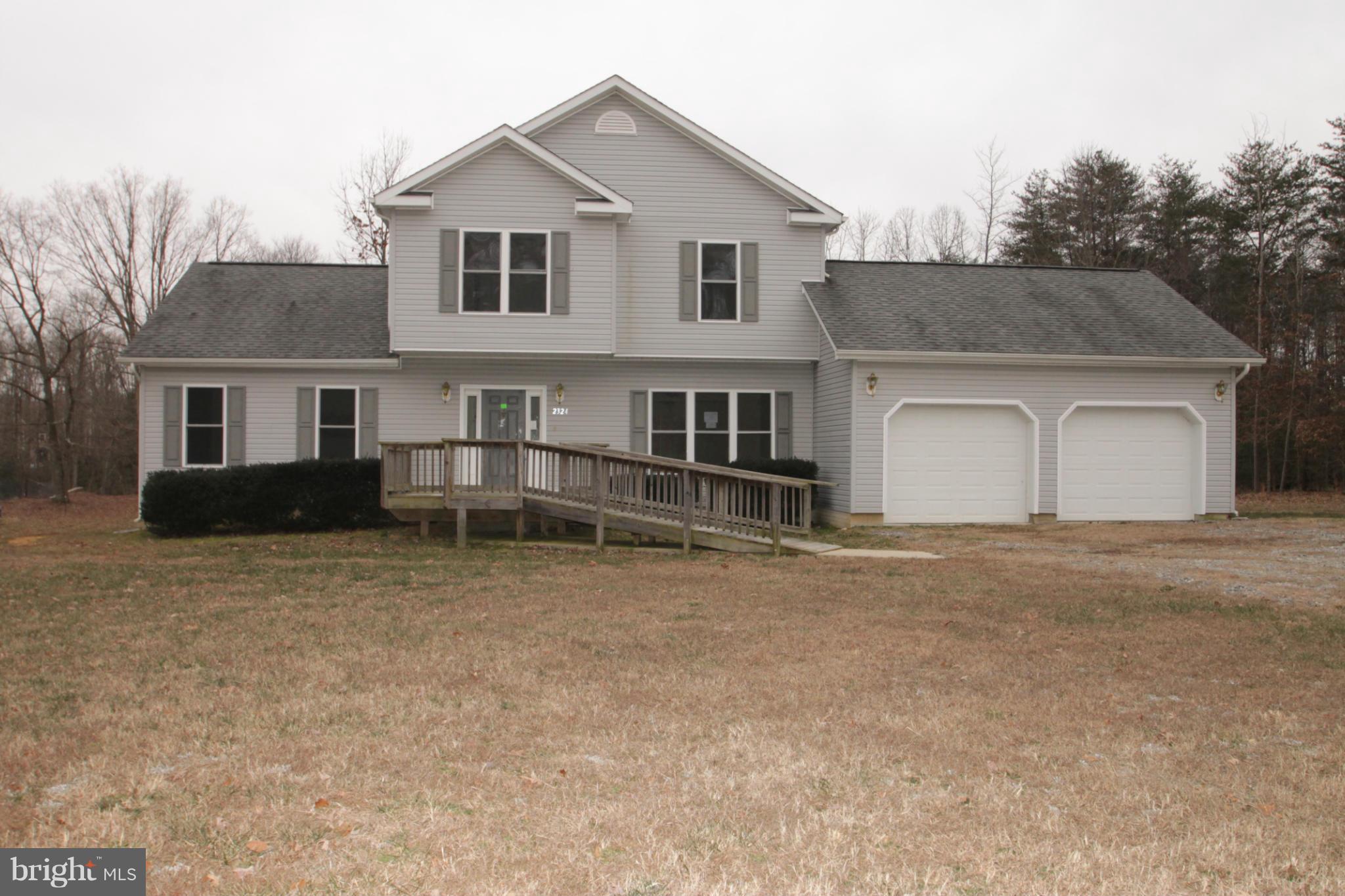 2324 Partlow Road Beaverdam, VA 23015 - Photo 1 of 27 a front view of a house with a yard