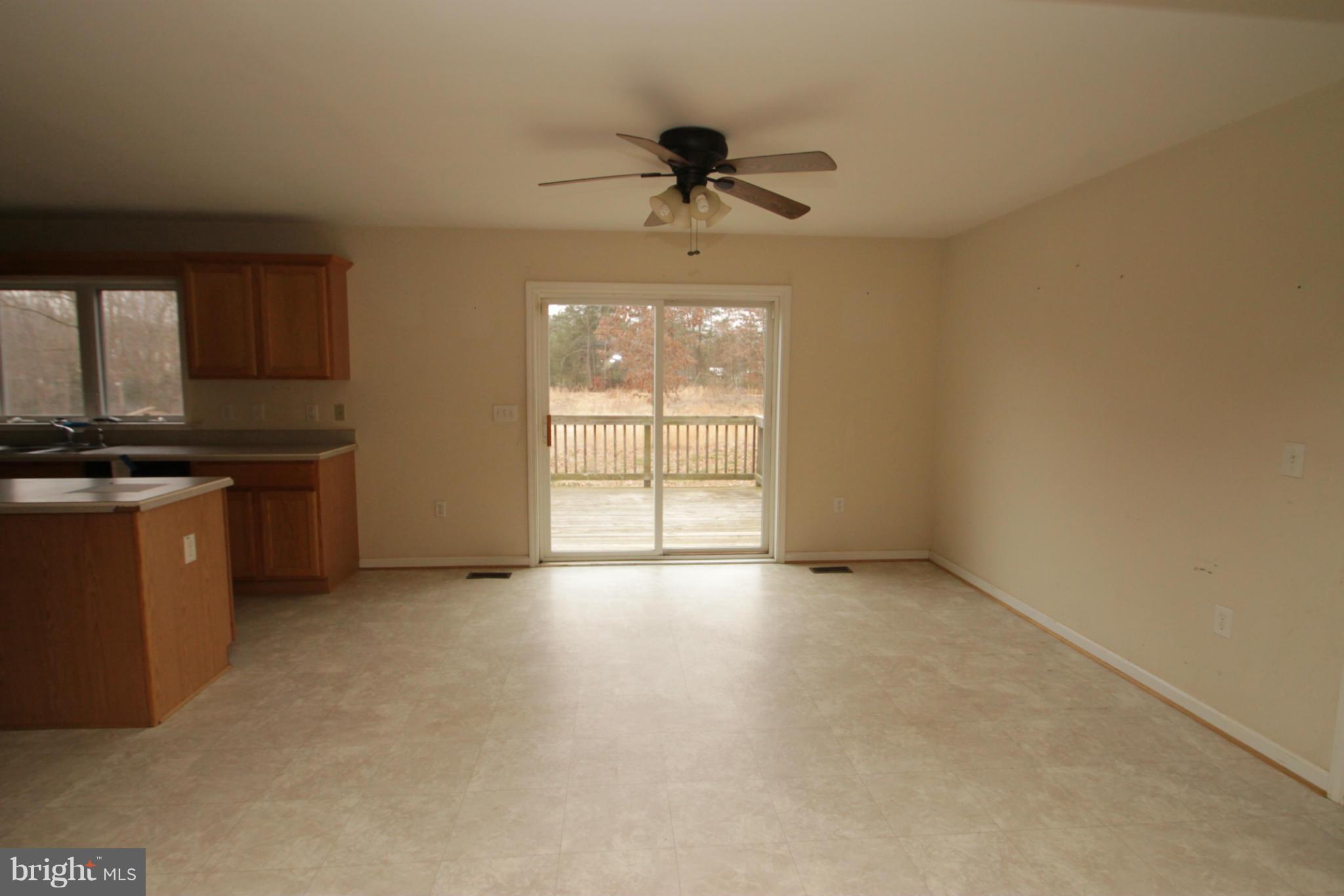 2324 Partlow Road Beaverdam, VA 23015 - Photo 13 of 27 an empty room with windows and ceiling fan