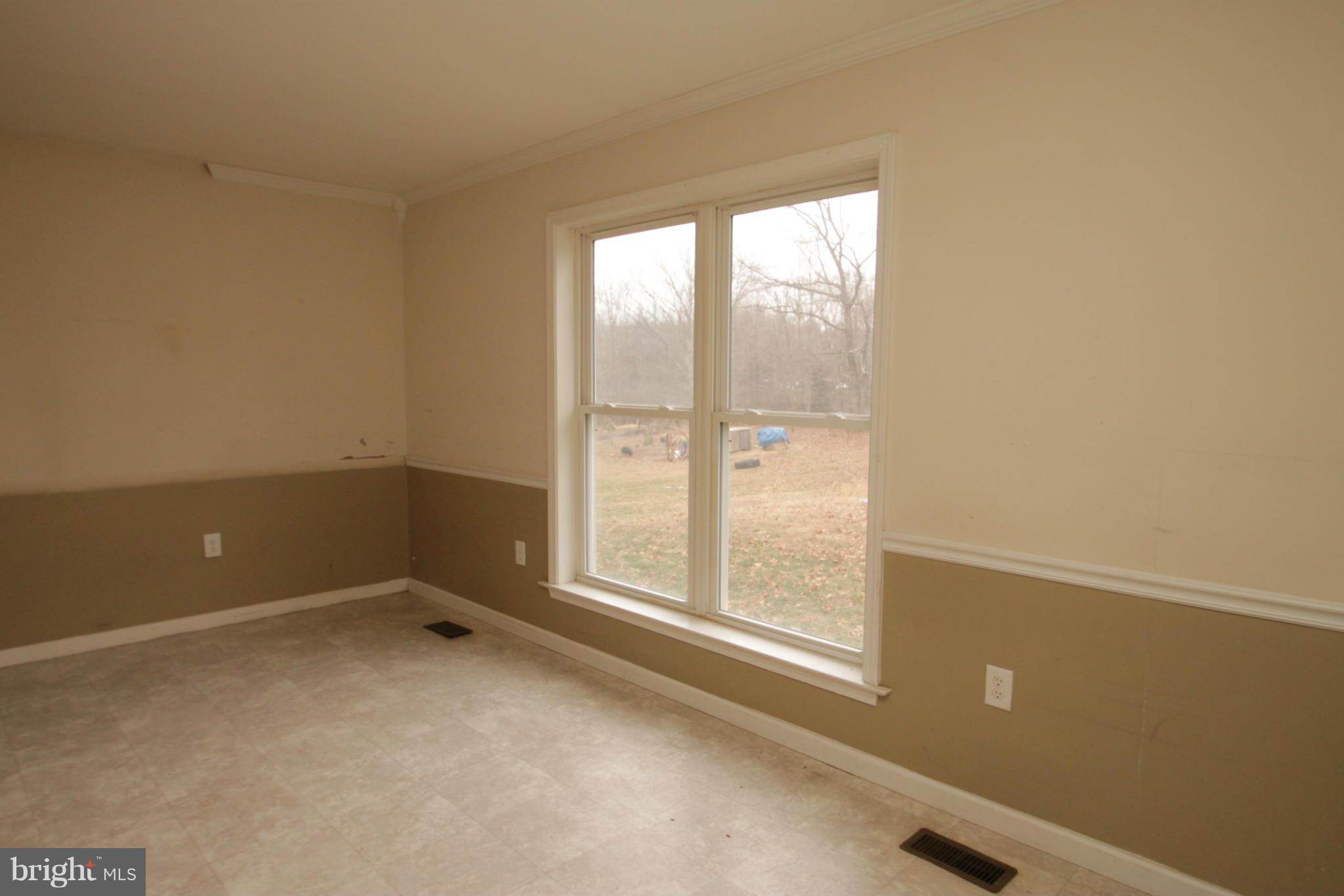 2324 Partlow Road Beaverdam, VA 23015 - Photo 17 of 27 an empty room with a window