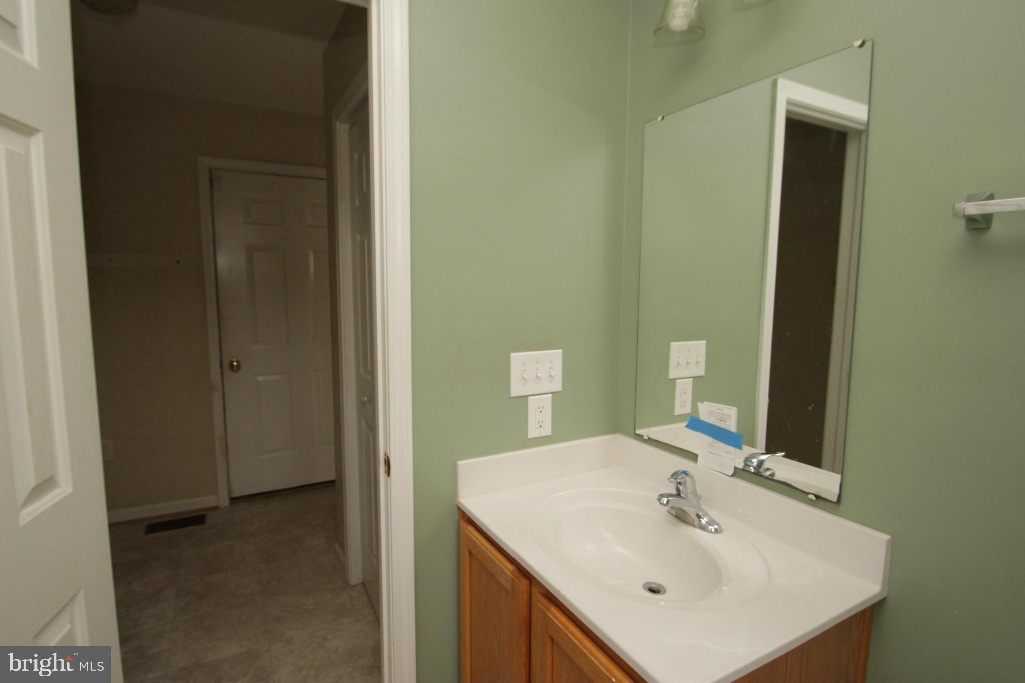 2324 Partlow Road Beaverdam, VA 23015 - Photo 20 of 27 a bathroom with a sink and a mirror
