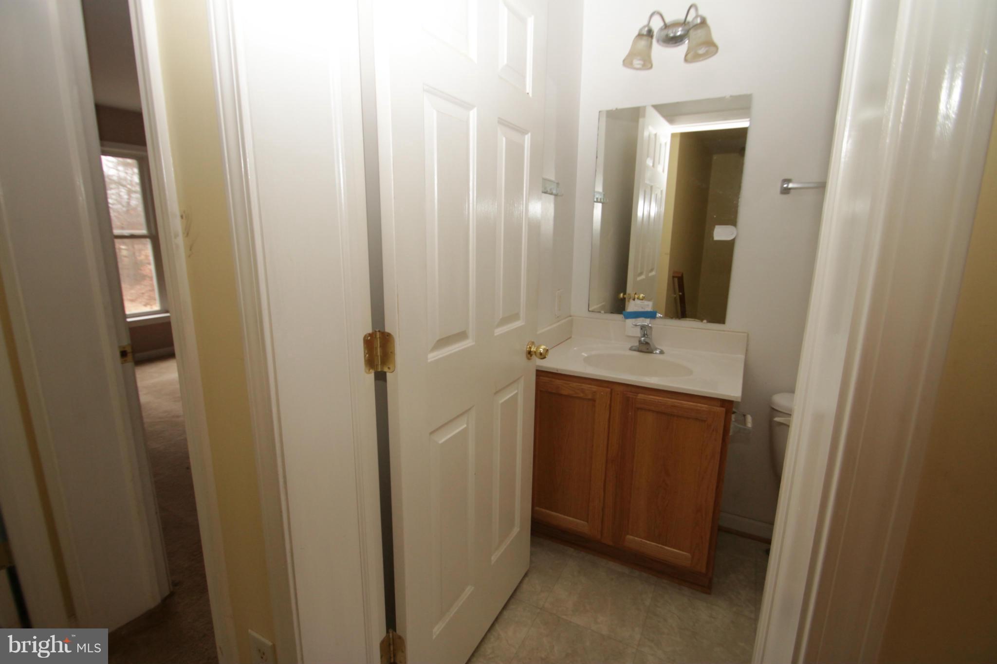2324 Partlow Road Beaverdam, VA 23015 - Photo 27 of 27 a bathroom with a sink and a mirror