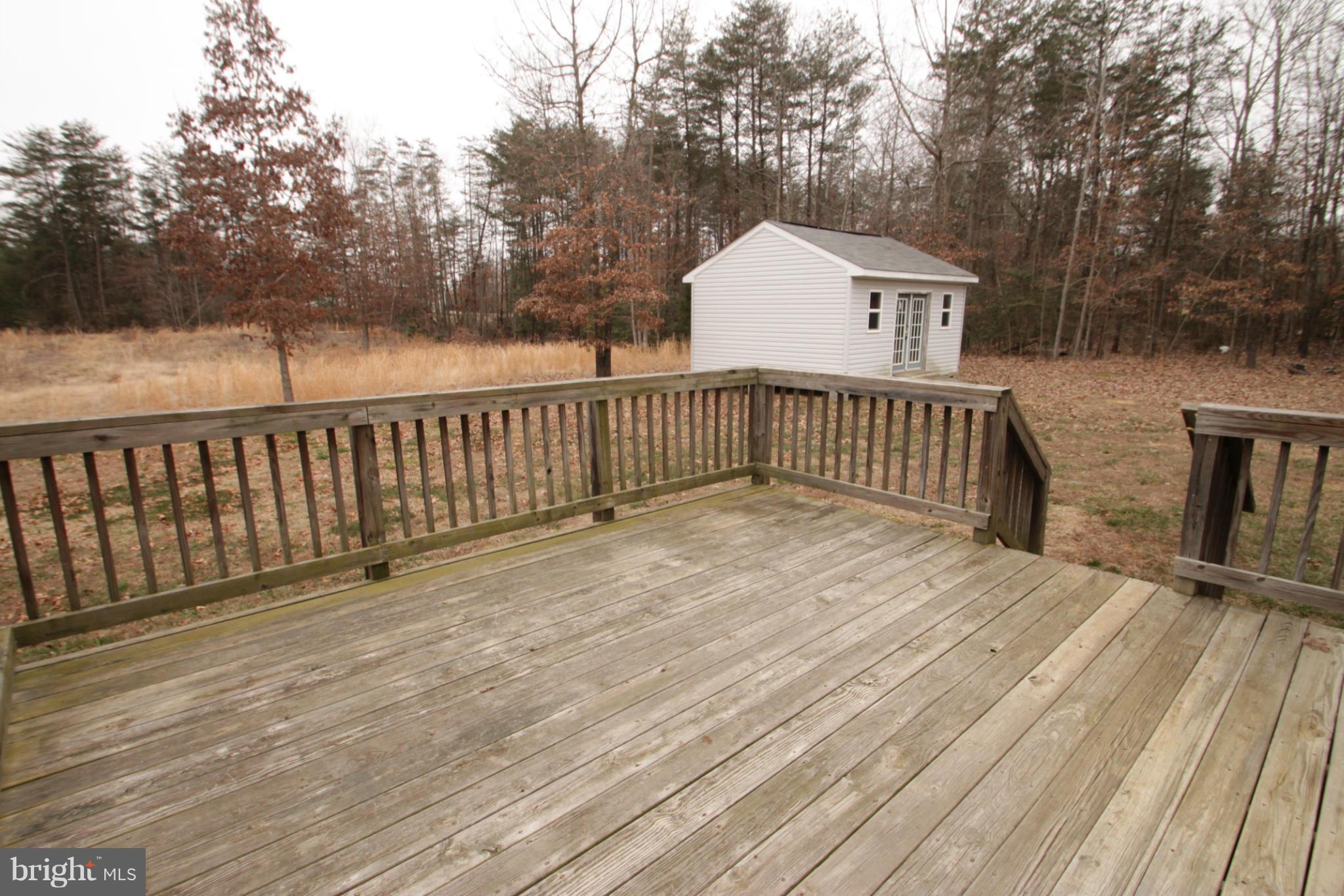 2324 Partlow Road Beaverdam, VA 23015 - Photo 4 of 27 a view of a wooden roof deck