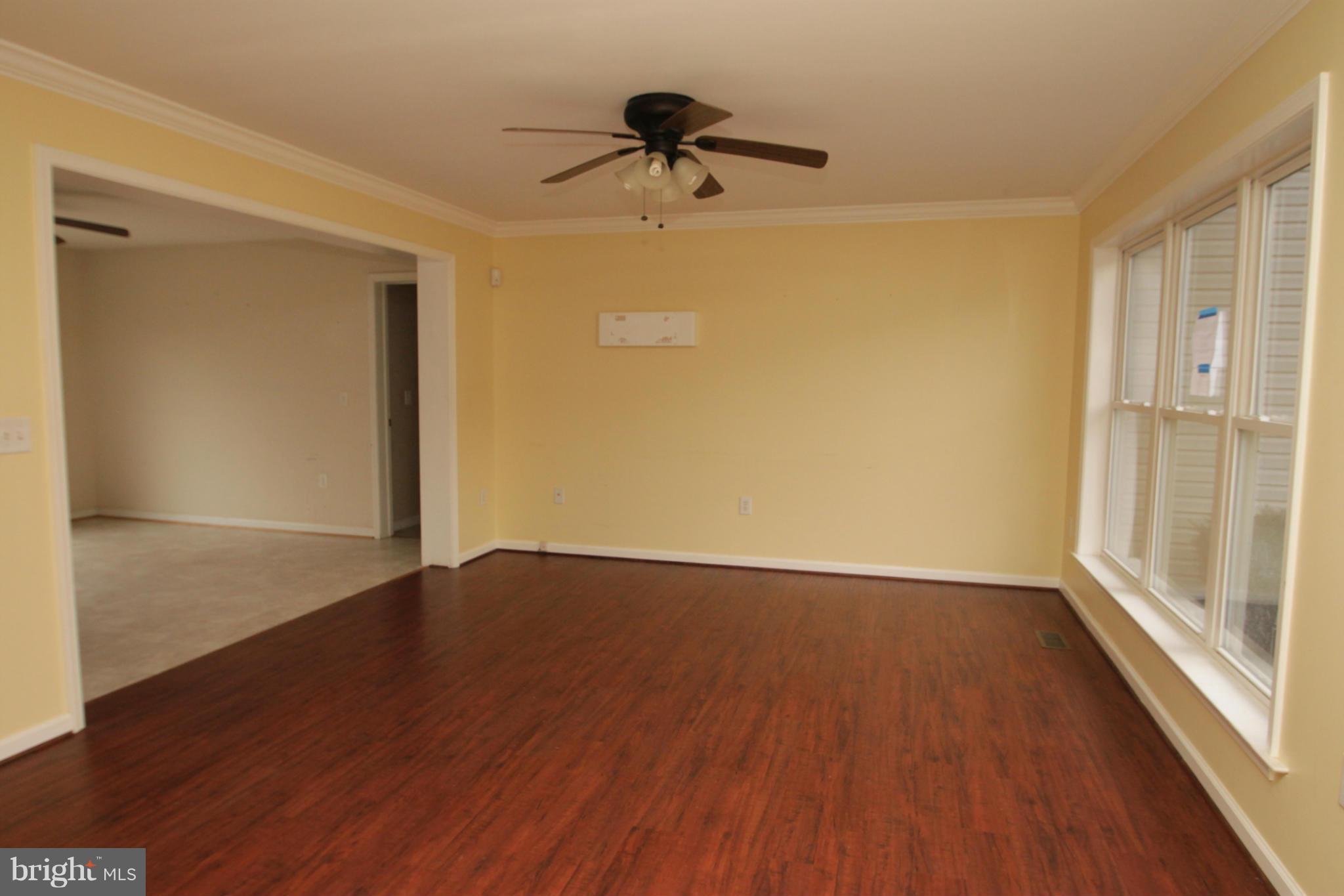 2324 Partlow Road Beaverdam, VA 23015 - Photo 9 of 27 a view of empty room with wooden floor and fan