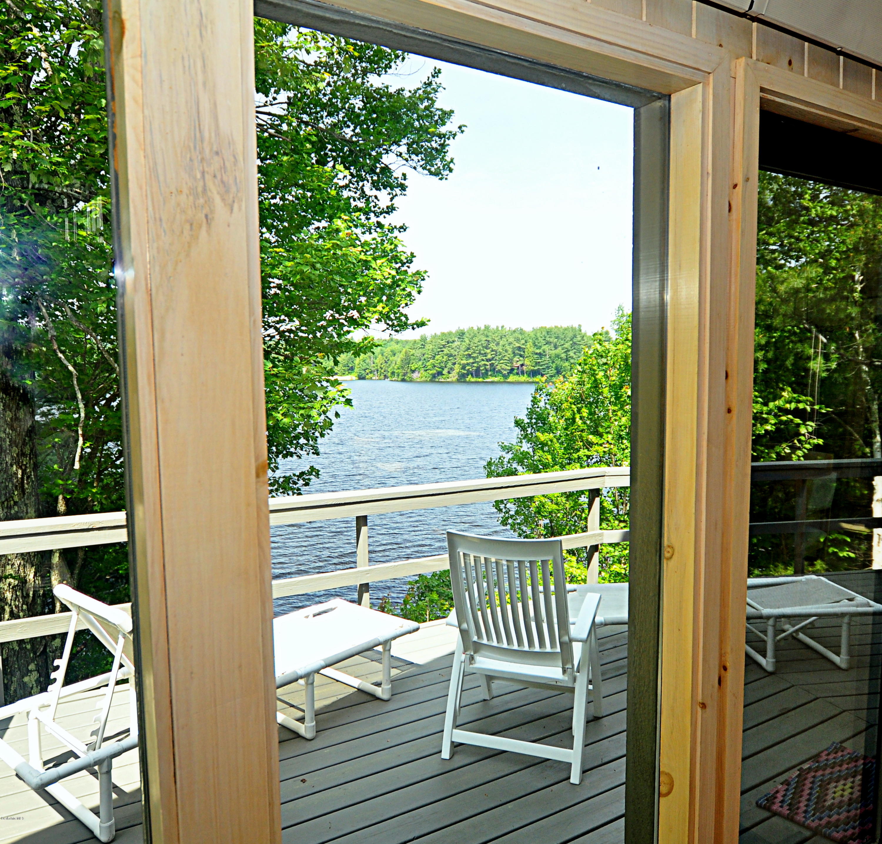 62 Algerie Road Becket, MA 01223 - Photo 2 of 29 a view of balcony with wooden floor and outdoor seating