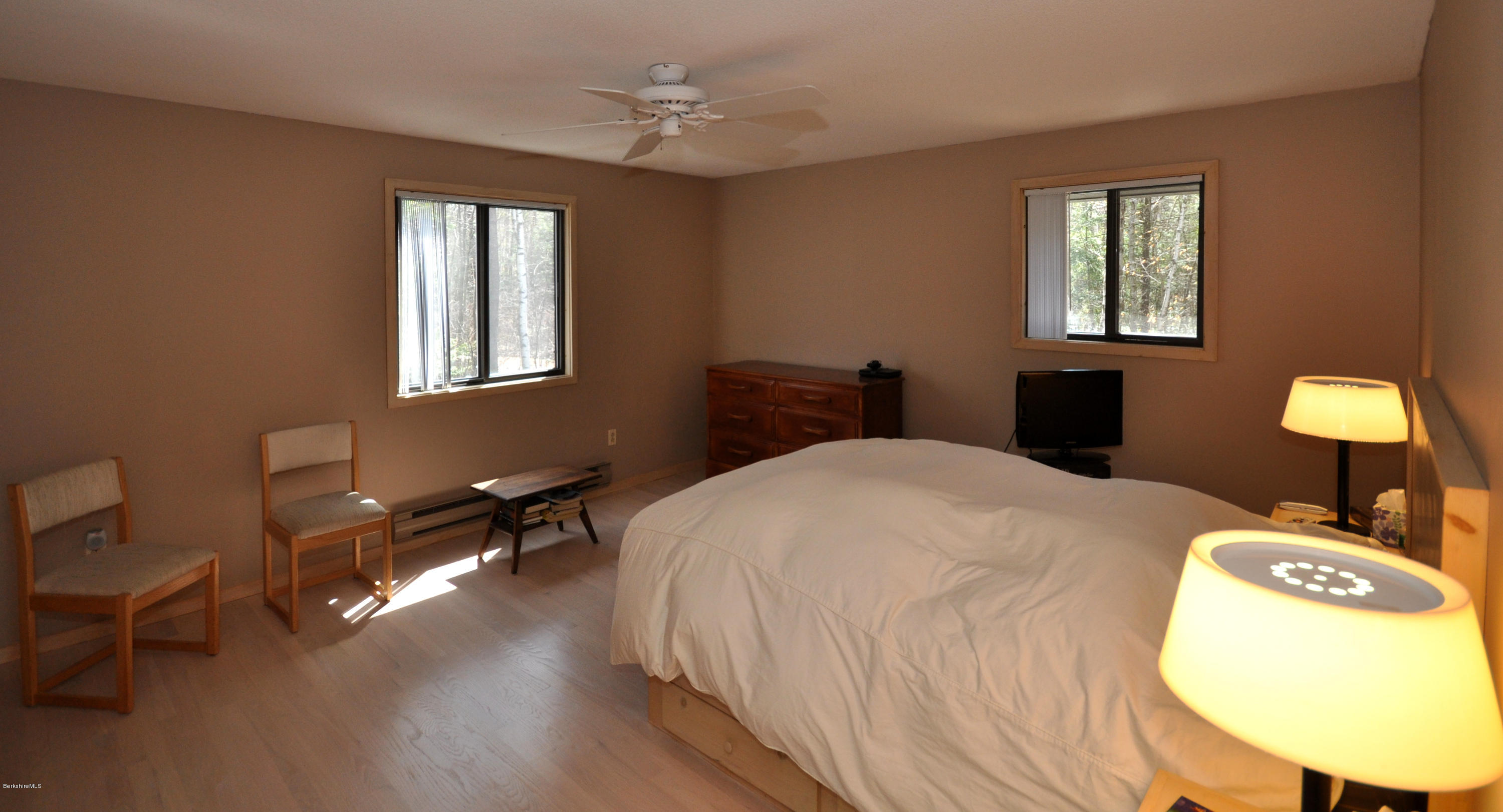 62 Algerie Road Becket, MA 01223 - Photo 15 of 29 a bedroom with a bed a chair and a window