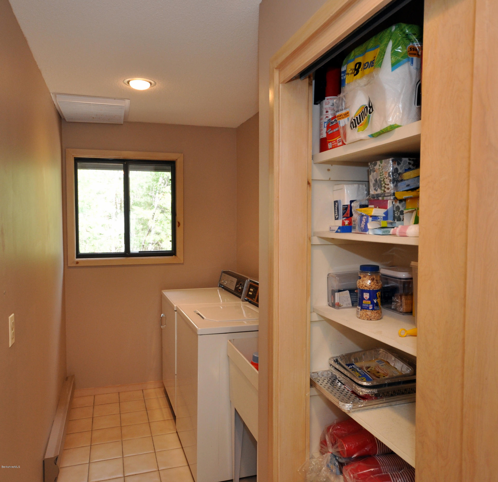 62 Algerie Road Becket, MA 01223 - Photo 19 of 29 a storage room with washer and dryer