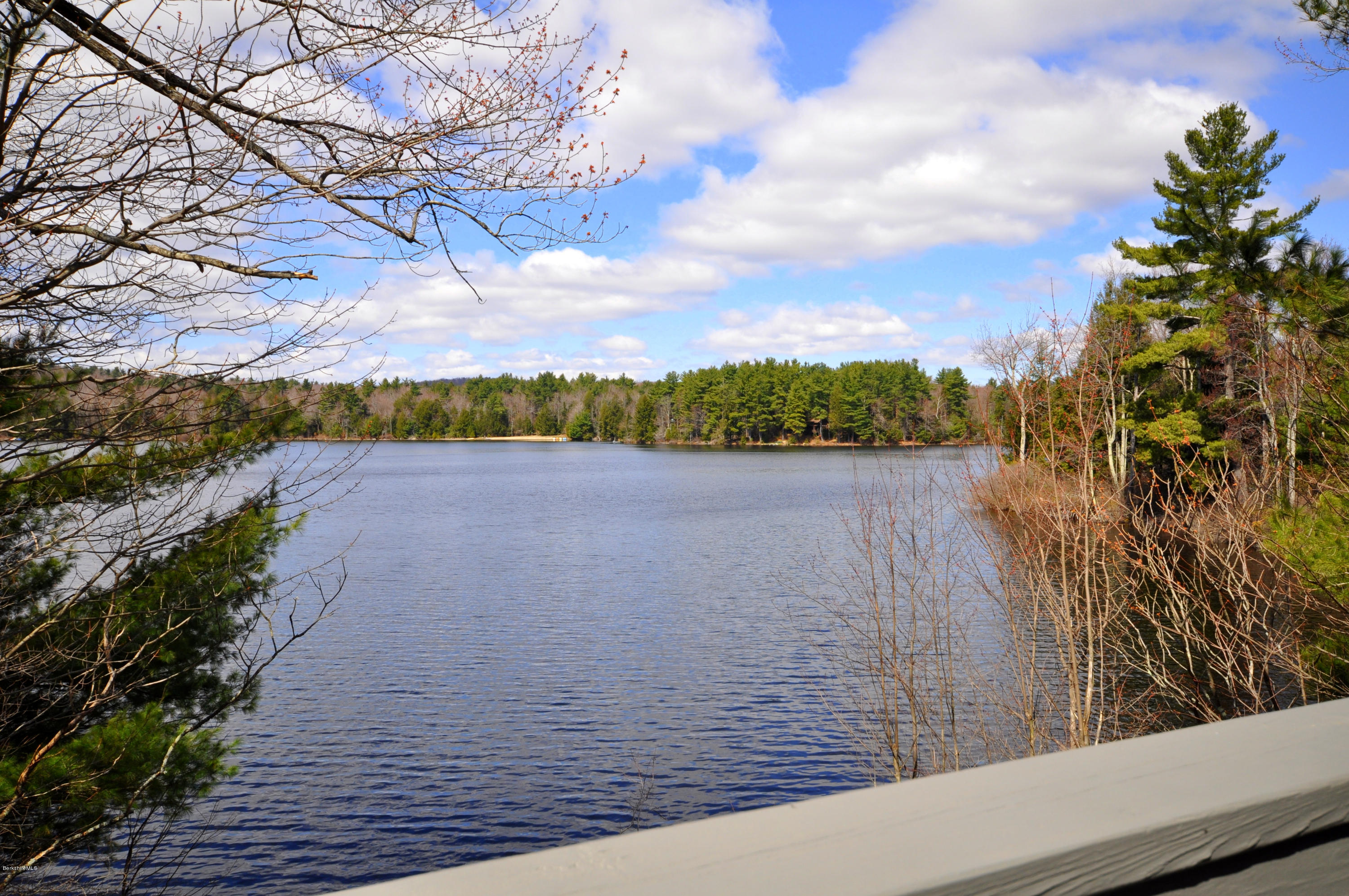 62 Algerie Road Becket, MA 01223 - Photo 5 of 29 a view of a lake from a yard
