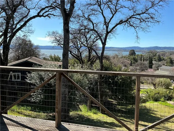 a view of a balcony with a trees