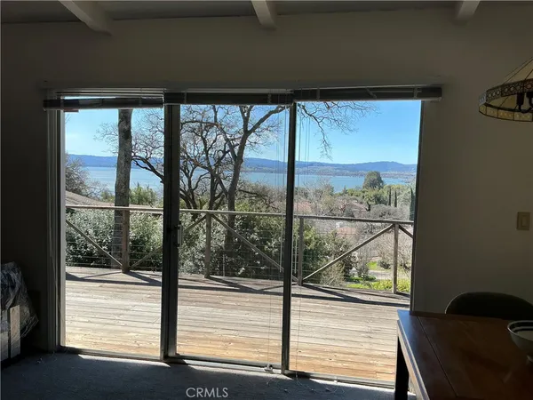 a view of a room that has a large window