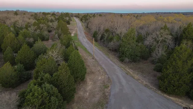 a view of a lake with beach and mountain view