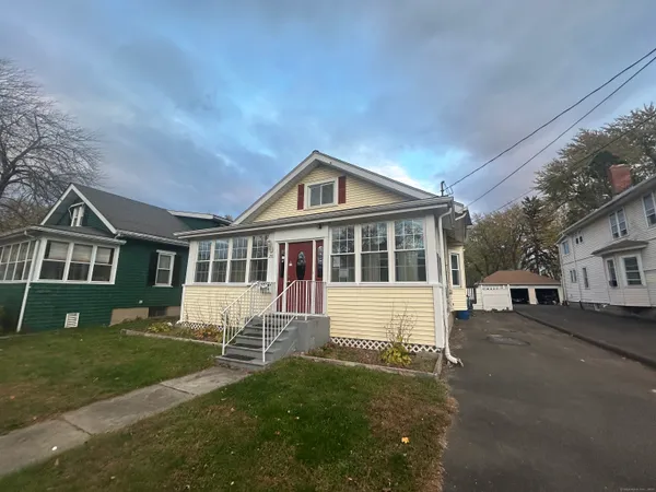 a front view of a house with a yard