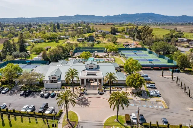 an aerial view of residential house with outdoor space and swimming pool