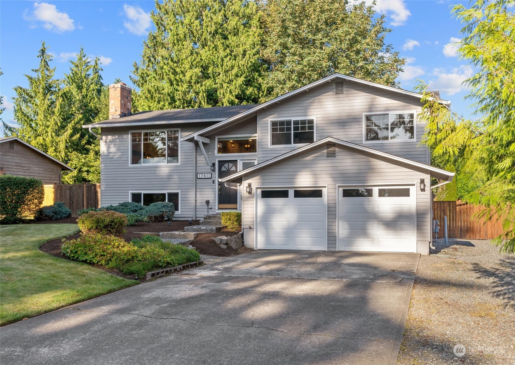 17411 30th Drive Southeast Bothell, WA 98012 - Photo 1 of 1 a front view of a house with a yard and garage