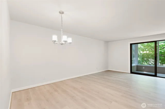 a view of a livingroom with a ceiling fan and window