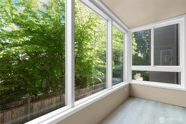 a view of room with green walls and floor to ceiling window