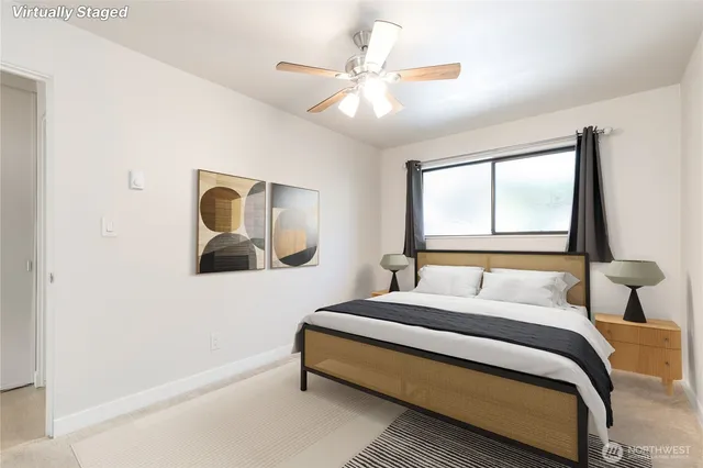 a bedroom with a large bed and a window