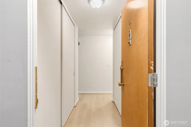 a view of a bathroom from a hallway