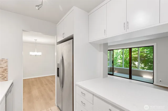 a view of kitchen with furniture and large window