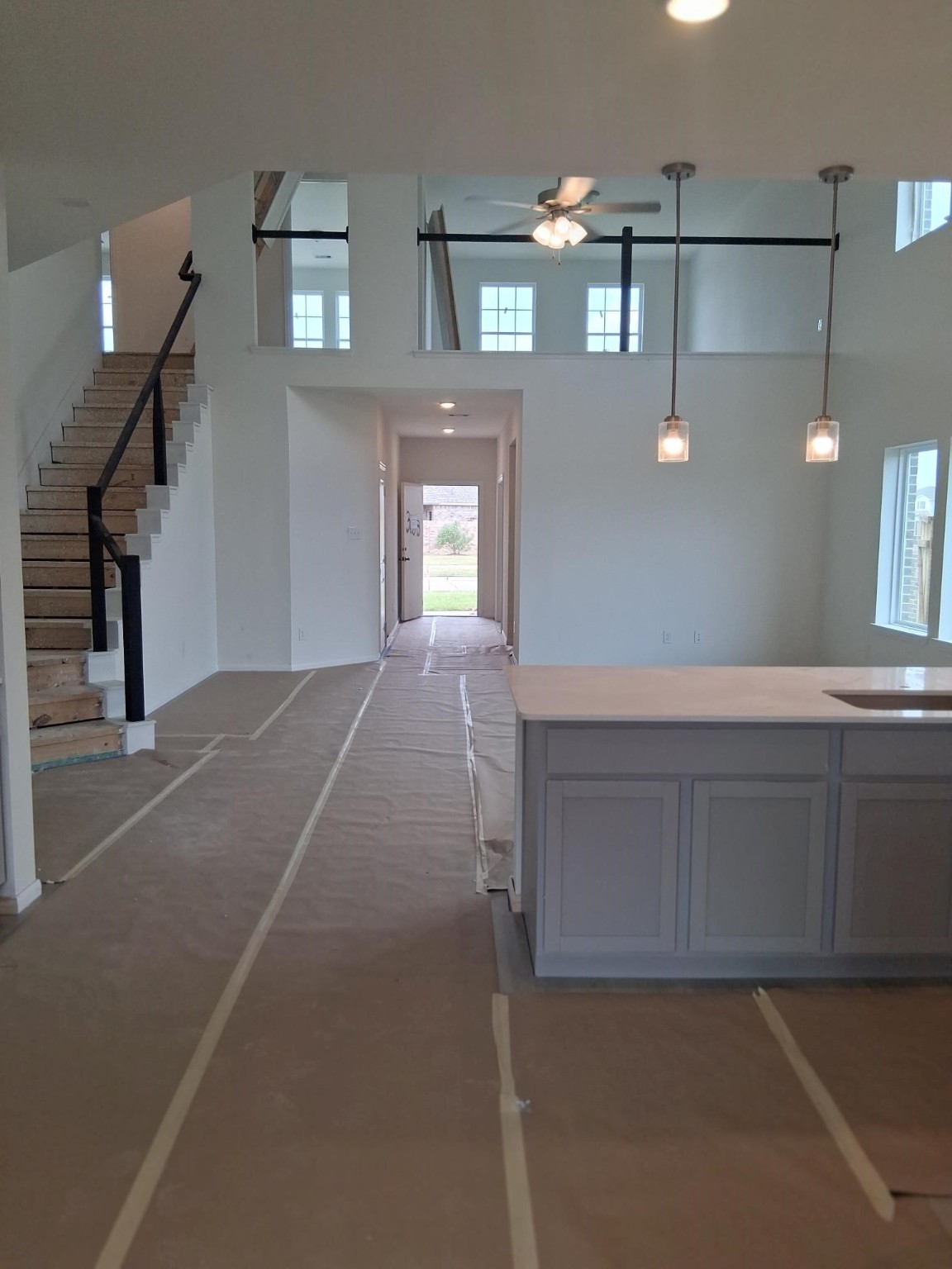 3603 Crosspointe Pass Angleton, TX 77515 - Photo 8 of 13 a view of a hallway with entryway and chandelier