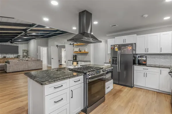 a view of a park with large trees