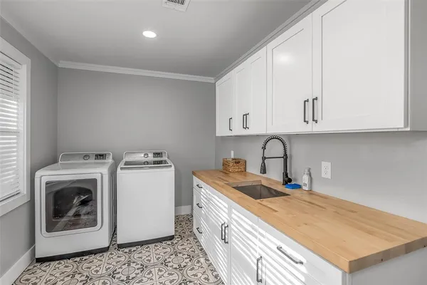 a kitchen with a table and chairs in it