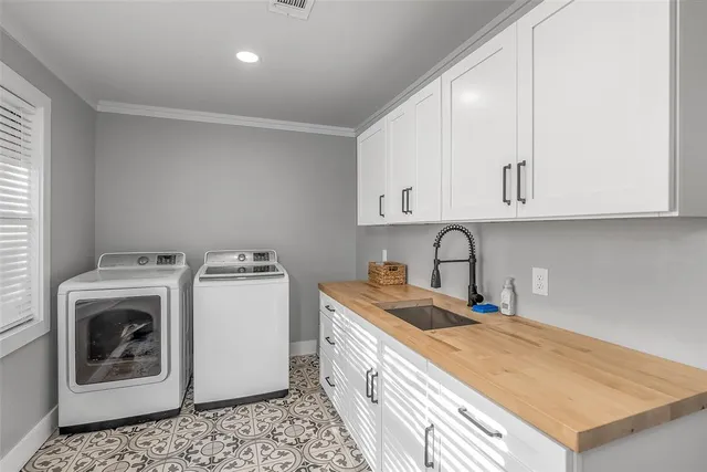 a kitchen with a table and chairs in it