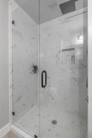 a bathroom with a granite countertop sink a toilet and a mirror