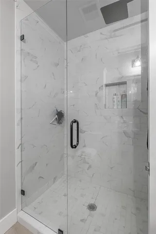 a bathroom with a granite countertop sink a toilet and a mirror