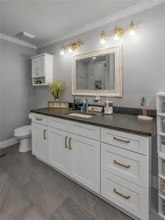 a bed room with a bed and a chandelier