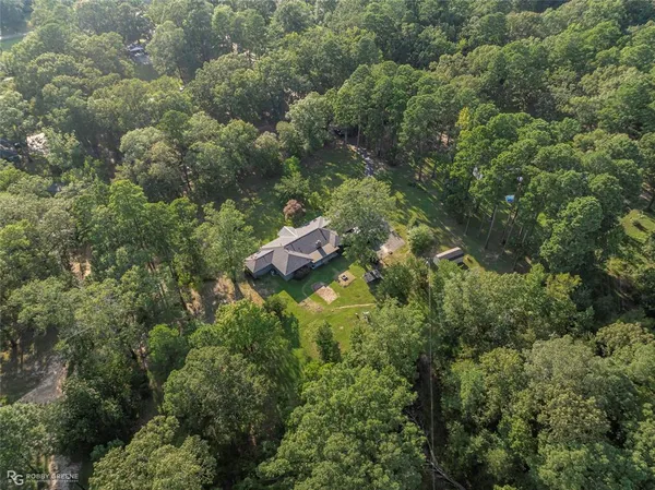 a room with lots of chairs and mirrors
