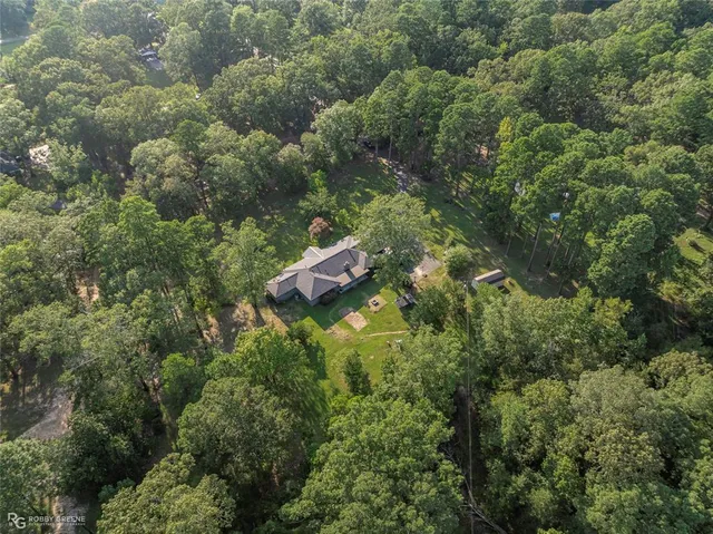 a room with lots of chairs and mirrors