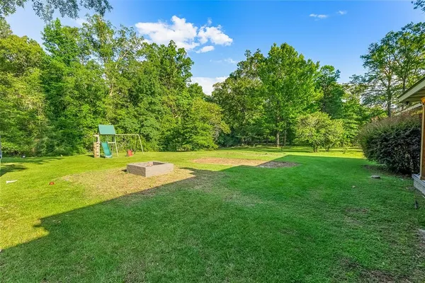 a view of a house with a big yard