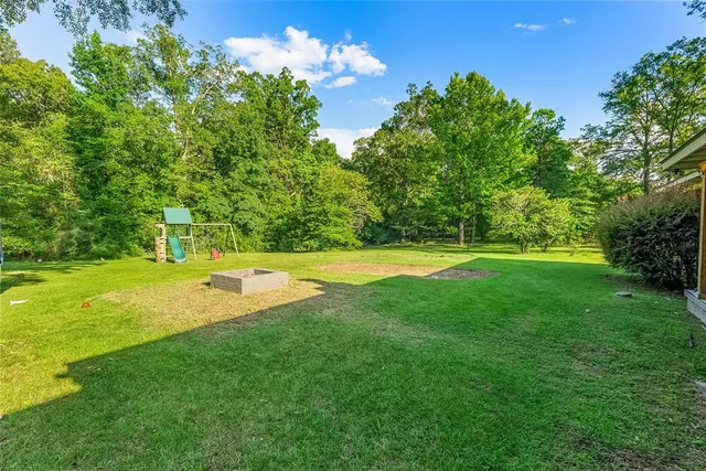 a view of a house with a big yard