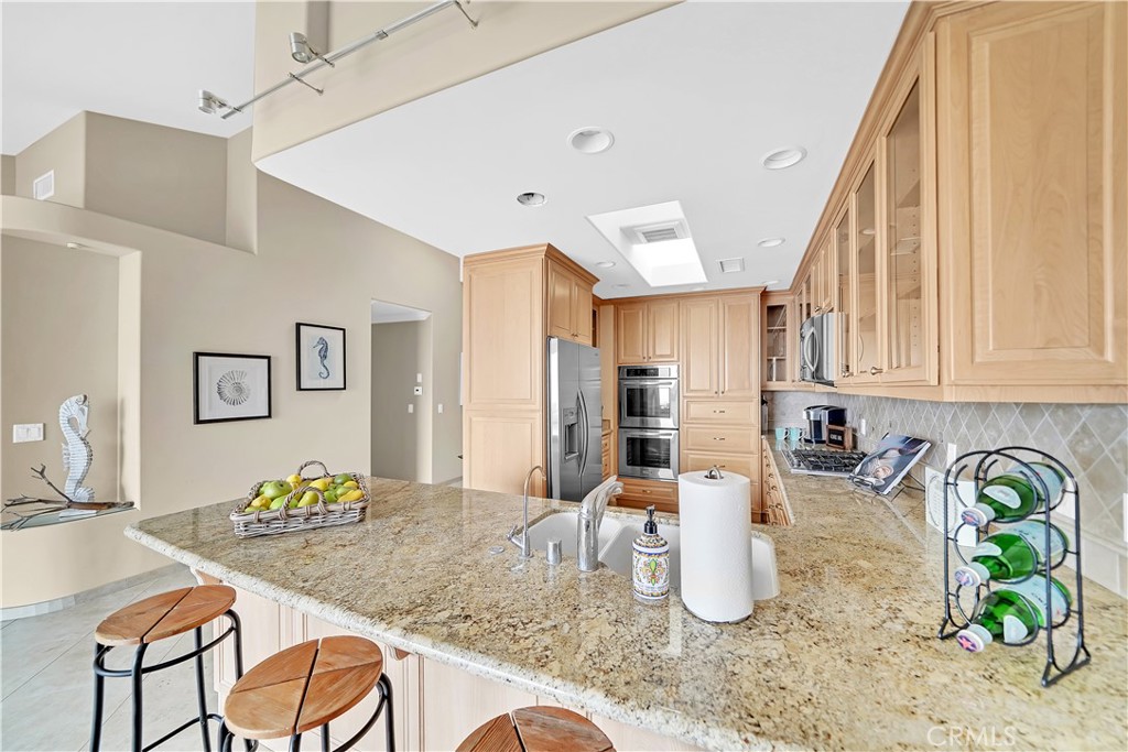 33631 Marlinspike Drive Dana Point, CA 92629 - Photo 11 of 39 a kitchen with granite countertop sink and a granite counter top space