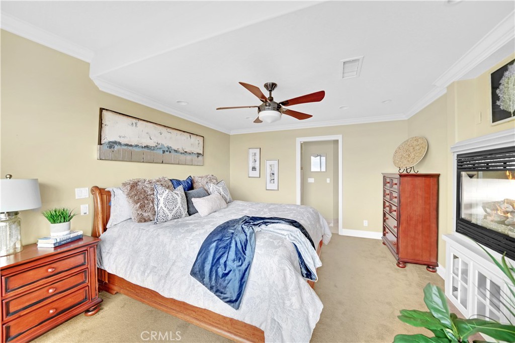 33631 Marlinspike Drive Dana Point, CA 92629 - Photo 17 of 39 a spacious bedroom with a bed and a flat screen tv