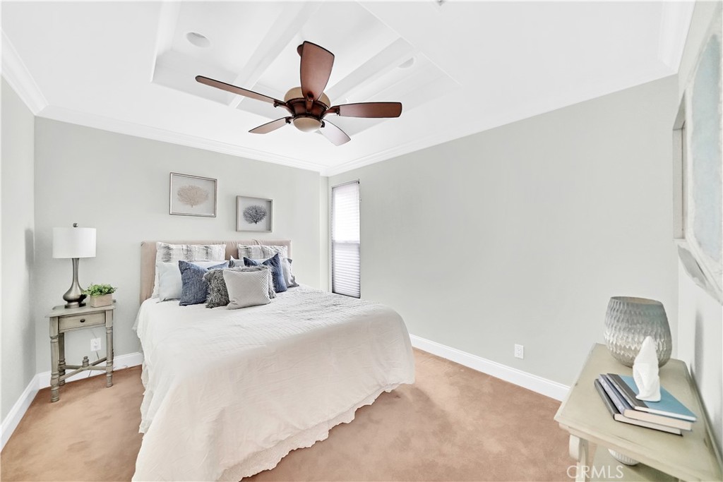 33631 Marlinspike Drive Dana Point, CA 92629 - Photo 25 of 39 a bedroom with a bed and a chandelier