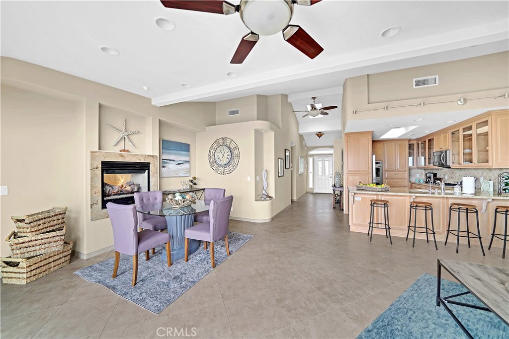 33631 Marlinspike Drive Dana Point, CA 92629 - Photo 8 of 39 a living room with fireplace furniture and a ceiling fan
