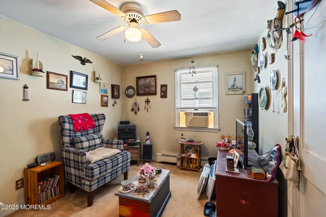 a bedroom with furniture a chandelier and a window