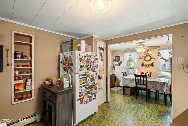 a view of a livingroom with furniture and workspace