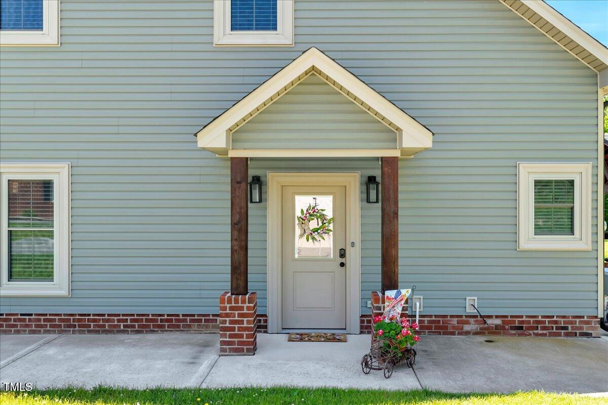 2258 Sanders Road Stem, NC 27581 - Photo 1 of 42 a front view of a house