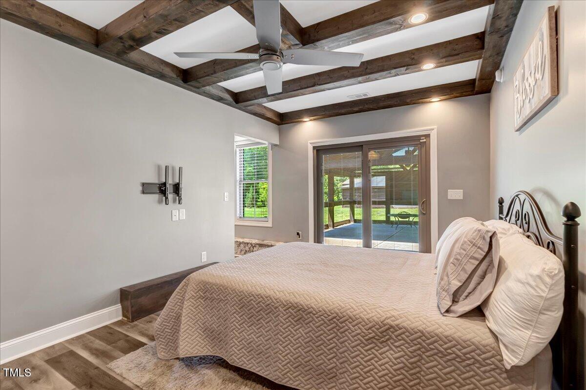 2258 Sanders Road Stem, NC 27581 - Photo 25 of 42 a bedroom with a bed and a window
