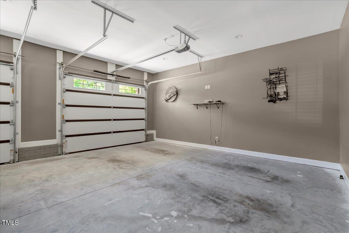 2258 Sanders Road Stem, NC 27581 - Photo 32 of 42 a view of a room with stairs and a white roof