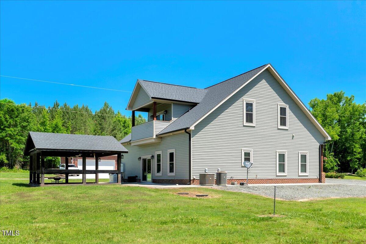 2258 Sanders Road Stem, NC 27581 - Photo 34 of 42 a view of a house with a yard and sitting area